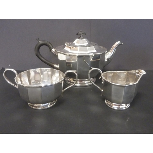 66 - E.p. three piece tea set of polygonal form and another with pierced edges.