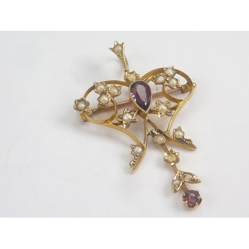 75 - Two Edwardian gold openwork pendants, pearl and garnet in gold, one '9ct'