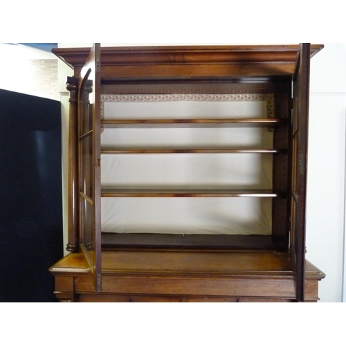 616 - Victorian mahogany bookcase cabinet, the upper section enclosed by glazed doors over four drawers wi... 