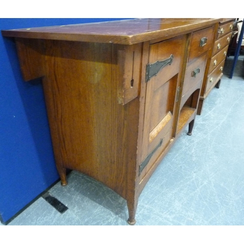 617 - Edwardian oak Arts and Crafts sideboard, the central cupboard flanked by two small drawers over rece... 