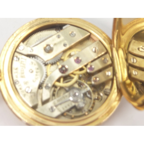 6 - Tiffany, gold and enamel level watch, nickelled movement jewelled to the centre, with wolf's tooth w... 