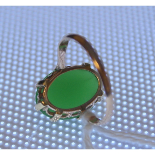 11 - Chinese chrystophase ring with oval cabochon in gold. Size 'J'.