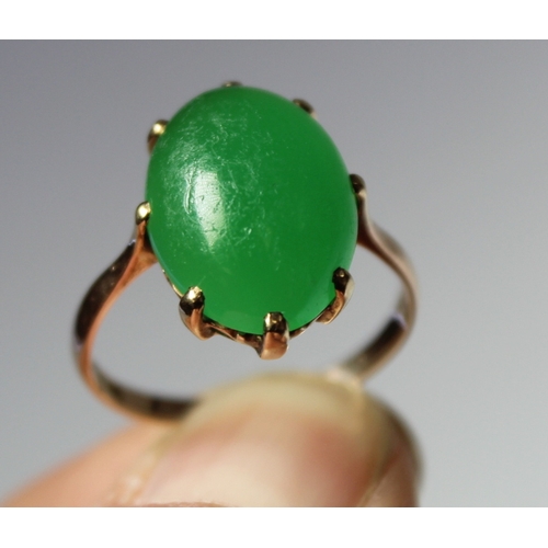 11 - Chinese chrystophase ring with oval cabochon in gold. Size 'J'.