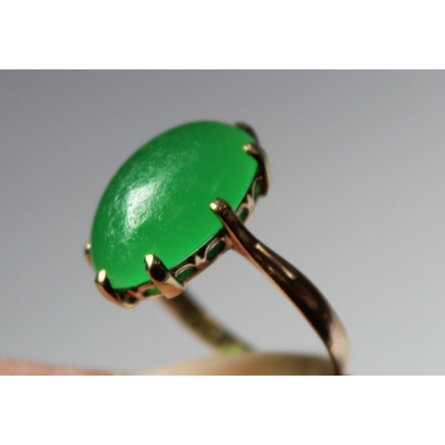 11 - Chinese chrystophase ring with oval cabochon in gold. Size 'J'.