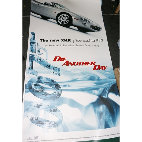 244 - Two Jaguar James Bond Die Another Day (2002) Jaguar XKR advertising banners, 2m x 1m.