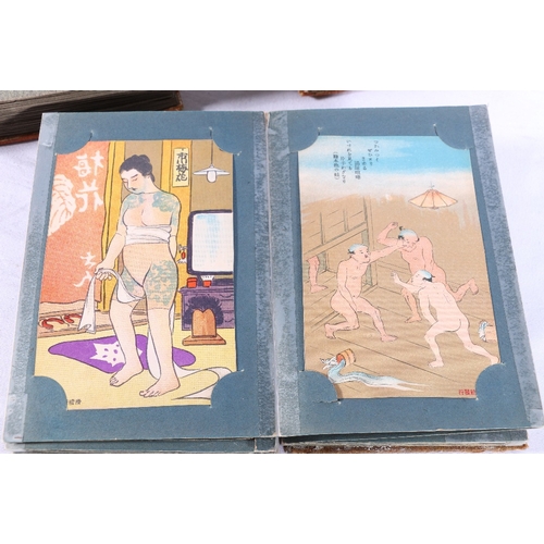 252 - Two albums containing approximately 180 early 20th century Japanese postcards, most are humorous alt... 