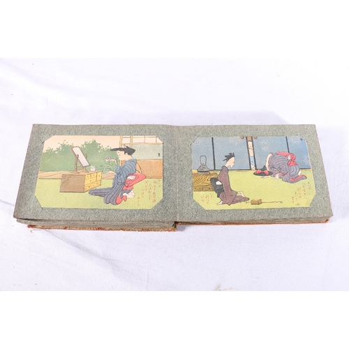 252 - Two albums containing approximately 180 early 20th century Japanese postcards, most are humorous alt... 