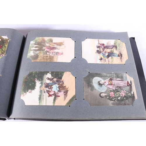 253 - Two albums of approximately 336 early 20th century Japanese coloured picture postcards depicting Jap... 