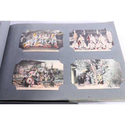 253 - Two albums of approximately 336 early 20th century Japanese coloured picture postcards depicting Jap... 