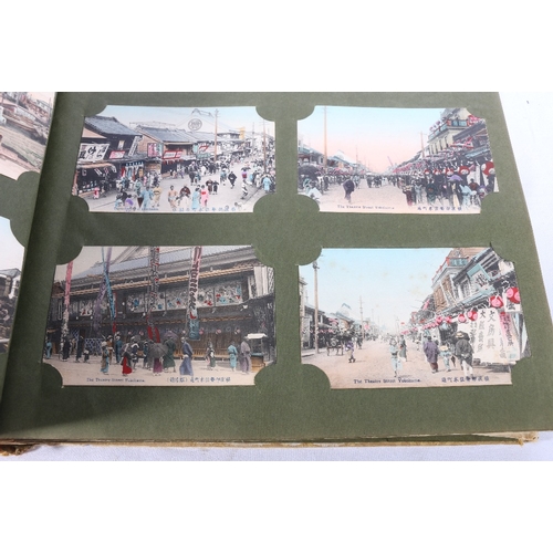 254 - An album containing approximately 500 early 20th century Japanese postcards most of topographical in... 