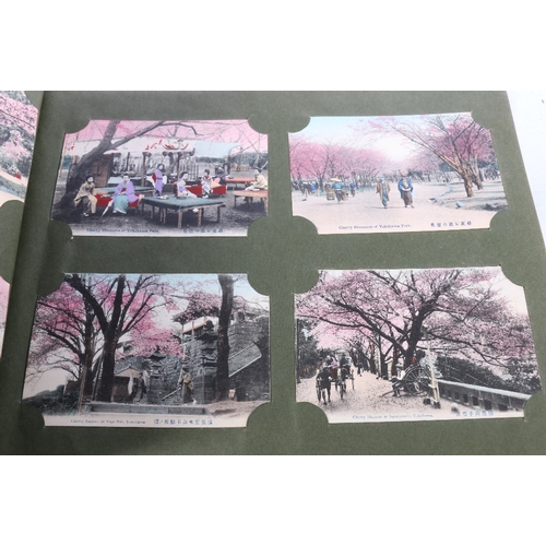 254 - An album containing approximately 500 early 20th century Japanese postcards most of topographical in... 