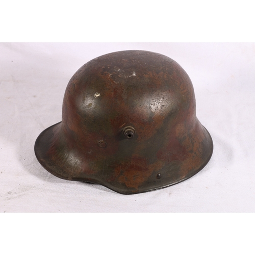 573 - German M16 steel helmet with painted camouflage design and partial leather liner