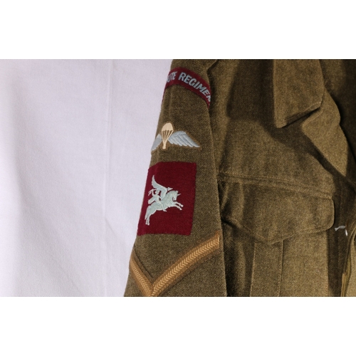 623 - Army uniform battle dress khaki green jacket by Tip Top Tailers Ltd dated to interior 1951 with Para... 