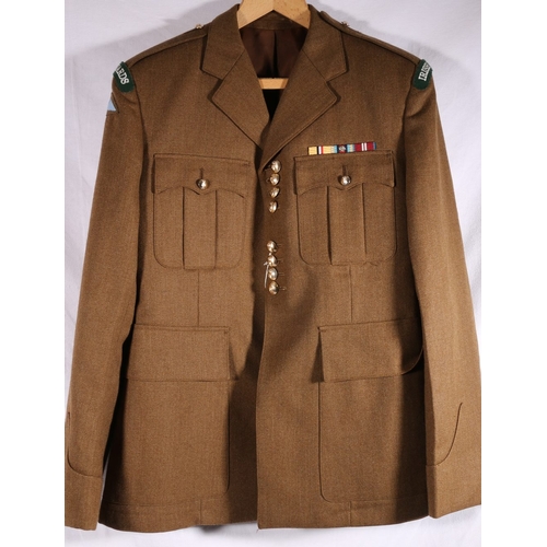 643 - Service Dress uniform of an officer of the Irish Guards of the British Army in green khaki tunic wit... 