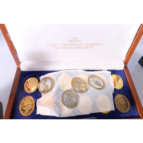 282 - Set of twelve silver gilt medals titled The Arms of HRH The Prince Andrew and Sarah Ferguson in fitt... 