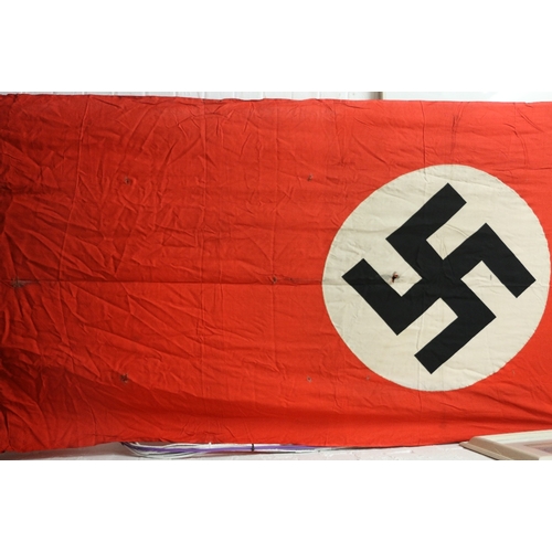 405 - German third riech Nazi swastika flag or banner with possible bullet holes and scorching, approximat... 