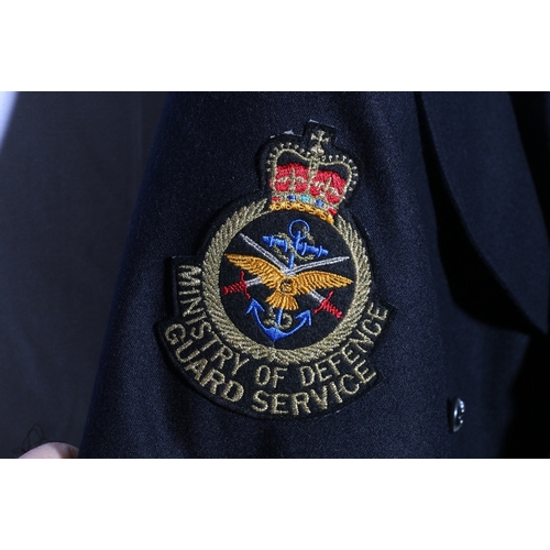 453 - Ministry Of Defence dress uniform black jacket with Dewhirst label with MOD enamel collar badges, ER... 