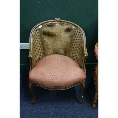 486 - French style bergere tub chair with carved top rail, raised on cabriole supports, 87cm tall.