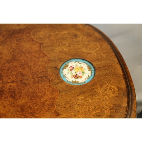 475 - 19th century walnut table with shaped edge, crossbanding, two circular Serves panels inset, shaped f... 