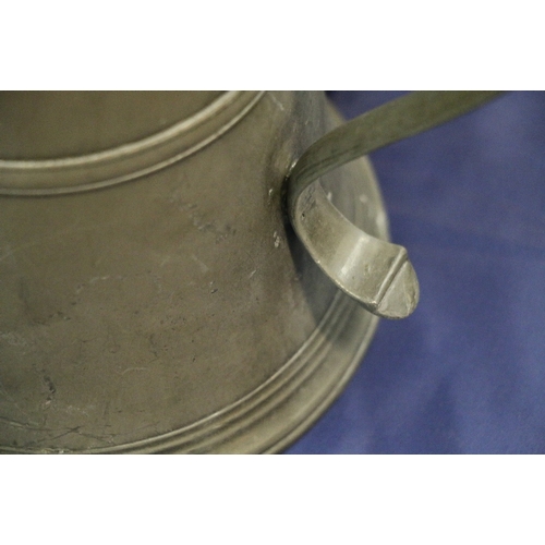 254 - Near pair of pewter communion lidded flagons or tankards, one stamped to interior 