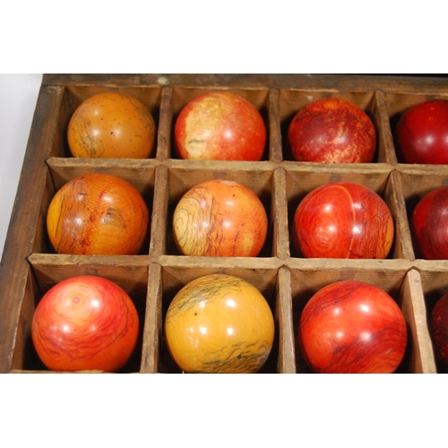 259 - Twenty-seven assorted 19th century billiard balls, some ivory, with box.