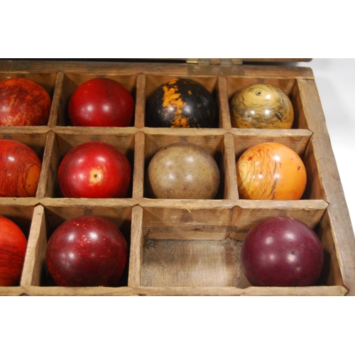 259 - Twenty-seven assorted 19th century billiard balls, some ivory, with box.