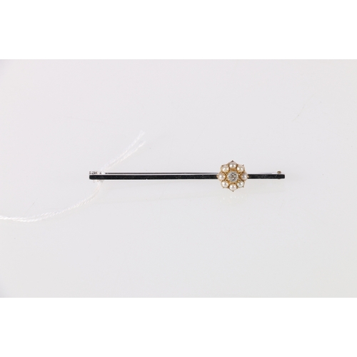 79 - White metal bar brooch set with approximately 0.15ct diamond encircled by eight round pearls, 3.27g,... 