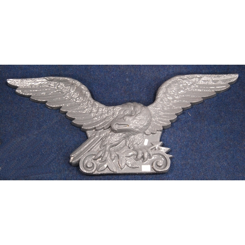 467 - Pair of 19th century cast iron eagle plaques, 95cm wide and 41cm high.