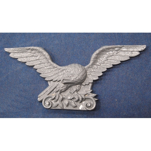 467 - Pair of 19th century cast iron eagle plaques, 95cm wide and 41cm high.