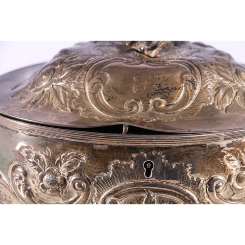 113 - George III silver tea caddy with repousse urn of flowers and scroll decoration and figural finial, p... 