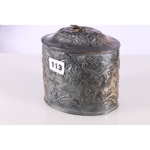 113 - George III silver tea caddy with repousse urn of flowers and scroll decoration and figural finial, p... 