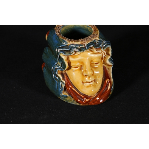 192 - Pottery candlestick holder modelled as the faces of a young male and female, possibly Scottish, regi... 