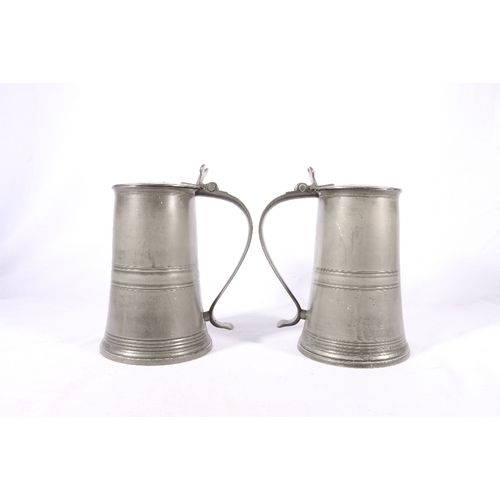 253 - Pair of pewter communion lidded flagons or tankards, stamped to interior 