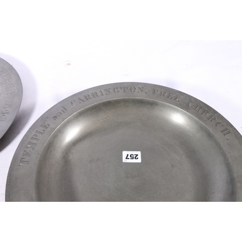 257 - Two pewter communion charger dishes or plates inscribed 