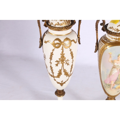 240 - Pair of French Limoges Serves style urns and covers with ormolu style mounts, the vignettes depictin... 