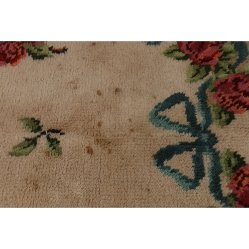 468 - Aubusson style carpet, the cream ground decorated with roses, 275cm x 200cm