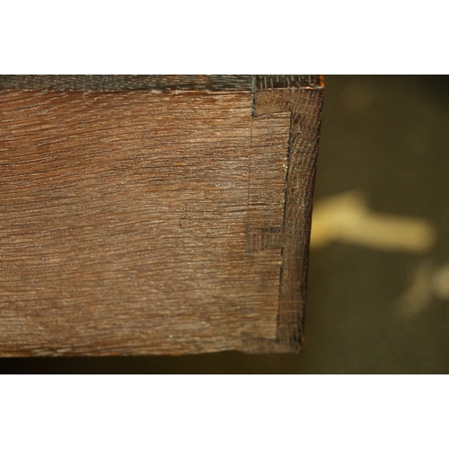 471 - Jacobean revival carved oak bureau with arrangement of five drawers having mask handles, 93cm wide