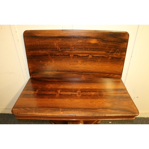 480 - Victorian rosewood turn over tea table raised on tapering octagonal column terminating in quadripart... 