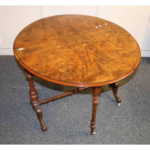 482 - Victorian walnut drop leaf table of oval shape with gate leg raised on carved cabriole supports term... 