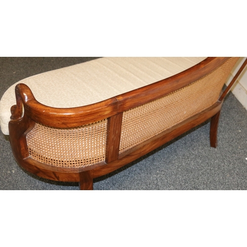 487 - Reproduction bergere chaise longue having swan neck and head arms, raised on cabriole supports, 131 ... 