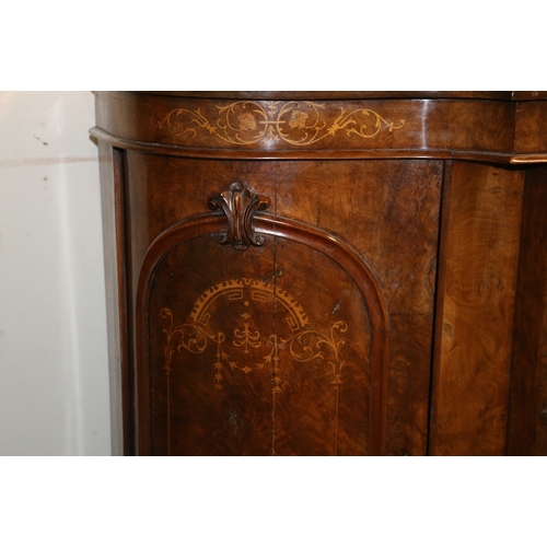 488 - Victorian walnut credenza of serpentine demi lune form having ledge back over three marquetry inlaid... 