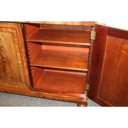 496 - Victorian mahogany chiffonier with shaped ledge back raised on scroll supports above faux frieze dra... 