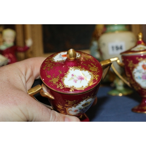 193 - Royal Vienna porcelain twin handled lidded urn and cover decorated with two vignettes depicting figu... 