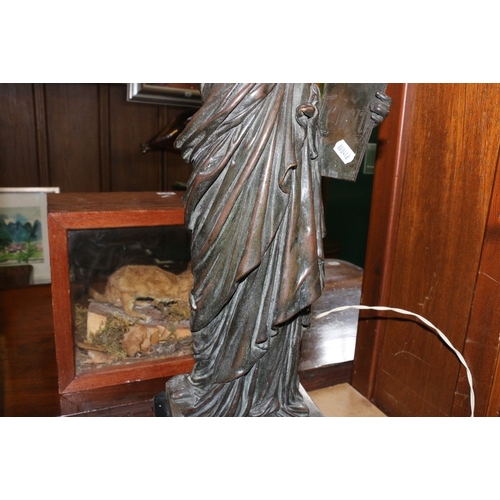 231 - Metal table light in the form of the statue of liberty, 68cm tall