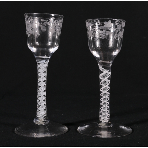 221 - Two antique ale glasses with etched bowls raised on opaque spiral twist stems and conical and socle ... 