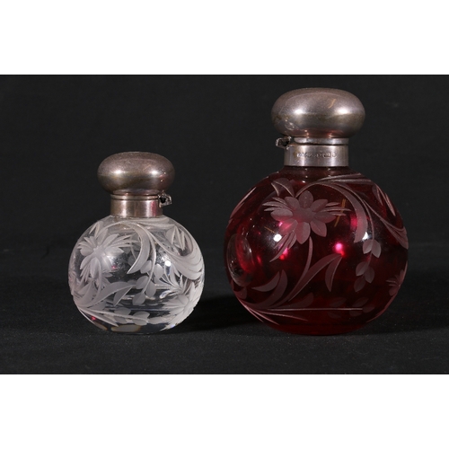 224 - Contemporary cranberry glass perfume bottle with cut floral design of spherical form having silver m... 