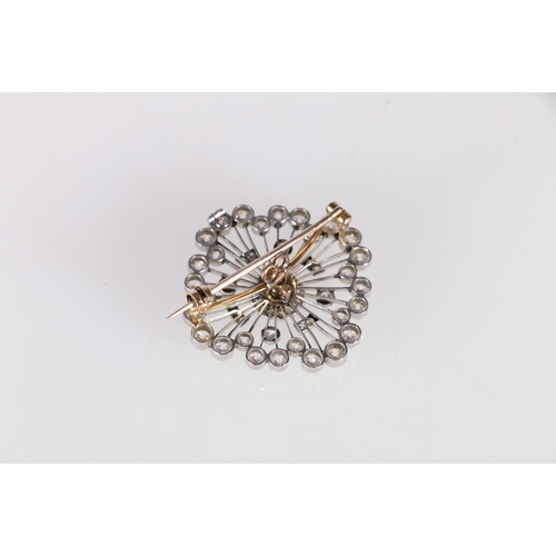 49 - Unhallmarked diamond set combination pendant brooch, the central diamond approximately 0.4ct, fifty-... 