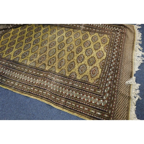 498 - Genuine handwoven Oriental carpet supplied by Vischshoonmaker (London) Limited, the field with seven... 