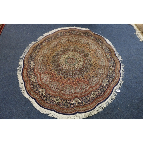 499 - Oriental circular rug with expanding mustered lotus flower design against a midnight blue ground, 15... 