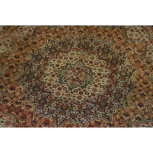 499 - Oriental circular rug with expanding mustered lotus flower design against a midnight blue ground, 15... 